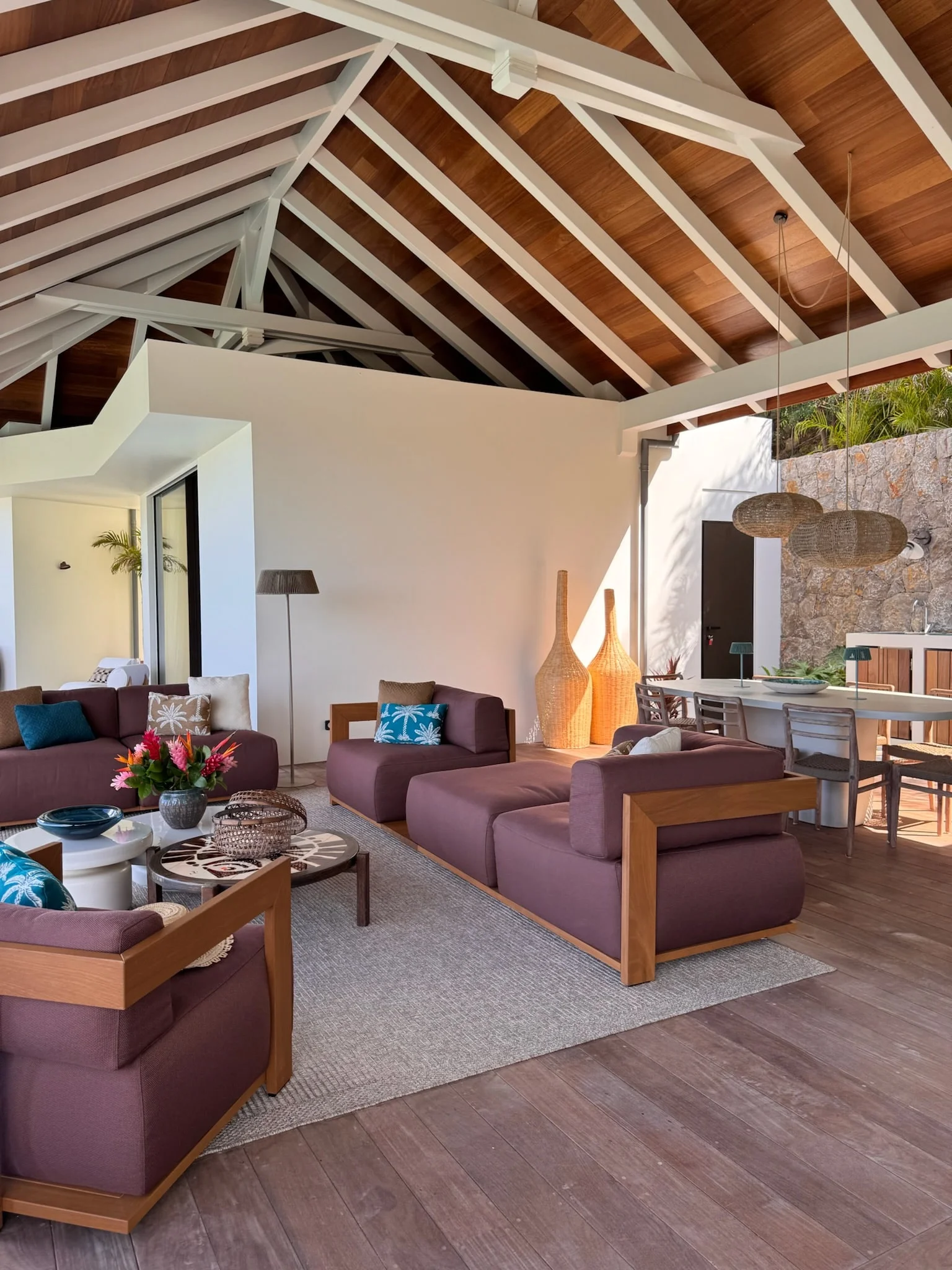 Open living area beneath a timber-framed roof — Anse des Cayes