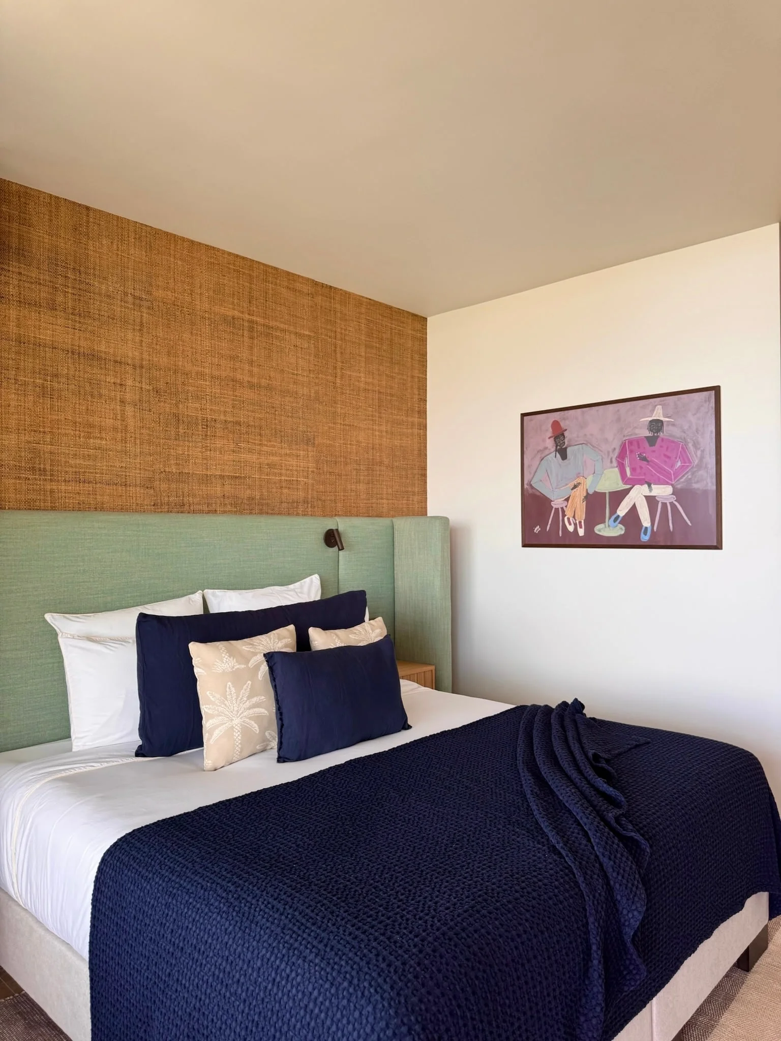 Bedroom with green headboard and navy bedspread — Anse des Cayes