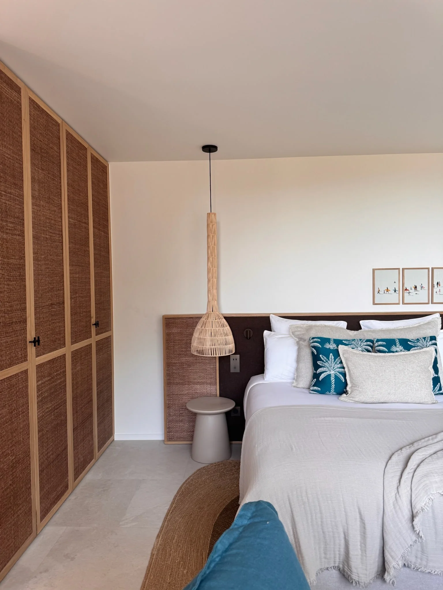 Bedroom with woven pendant light and woven wardrobe doors — Anse des Cayes