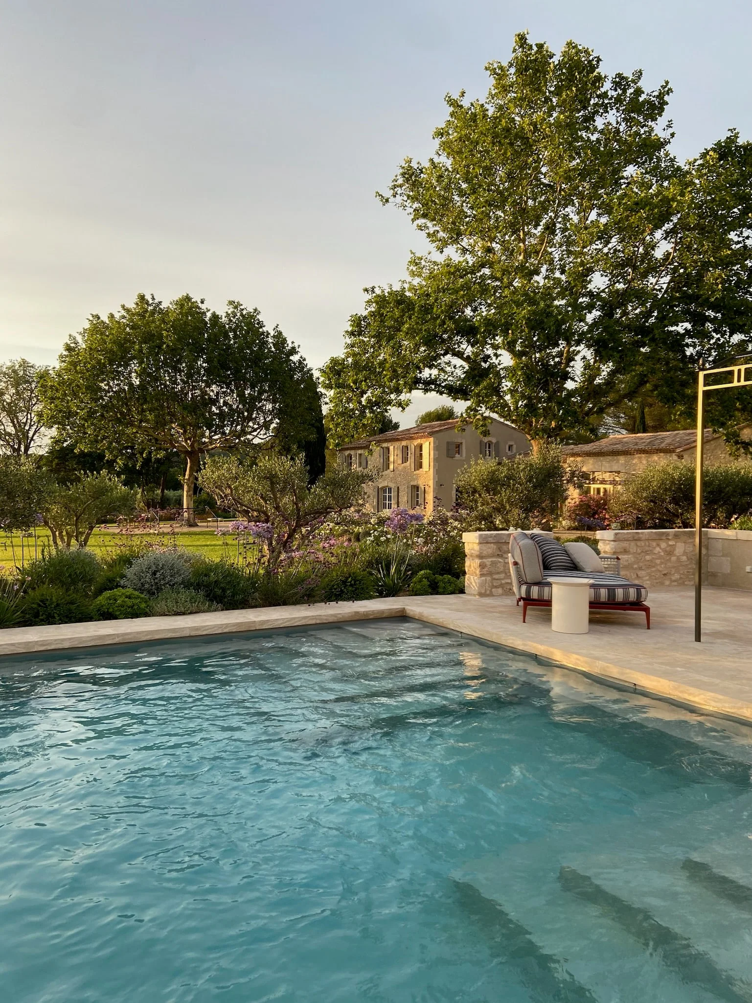 The pool at the end of the day, the house beyond — Montjoie