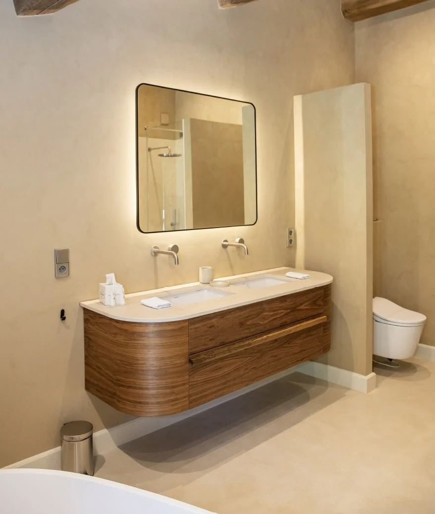 Double washbasin on a curved wooden vanity with backlit mirror — Montjoie